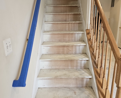 Staircase under renovation with protective covering